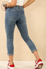 Back view of denim blue petite cropped jeans womens with zip closure and slim fit