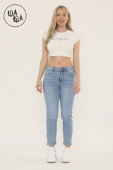 Model wearing everyday blue cropped jeans with slim fit and stretchy fabric