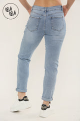 Back view of Stylish women’s ankle length slim fit cropped jeans in blue