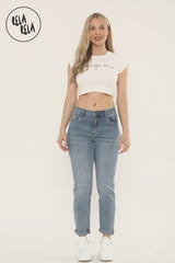 Model wearing Ankle Length Stretchy Slim Fit Cropped Jeans in Mid Blue Wash