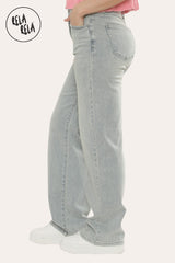 Side view of stretchy blue jeans with soft fit and flattering high waist in light blue wash