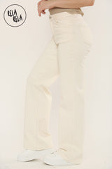  Side view of stretchy straight leg jeans with soft fit and flattering high waist in Cream