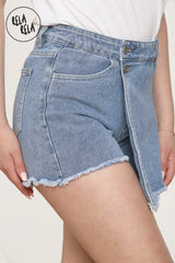 Side angle showing the hidden shorts under the blue wrap front denim skort overlay