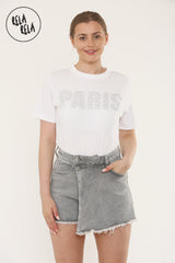 Model wearing grey mid-rise skorts in asymmetric wrap front design