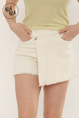 Close-up of the stretchy waistband, front buttons and frayed hem details on the cream wrap front skorts