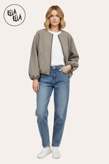 Model wearing oversized bleach grey zip-up bomber jacket pair with jeans