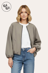 Front view of oversized bleach grey zip-up bomber jacket for women