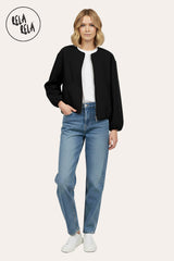 Model wearing oversized black zip-up bomber jacket, pair with jeans