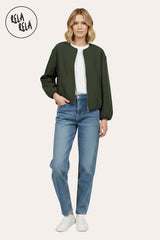 Model wearing oversized khaki zip-up bomber jacket, pair with jeans