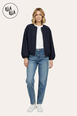 Model wearing oversized navy zip-up bomber jacket, pair with jeans