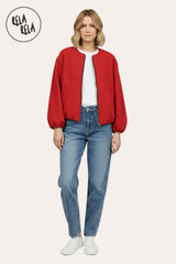 Model wearing oversized red zip-up bomber jacket, pair with jeans