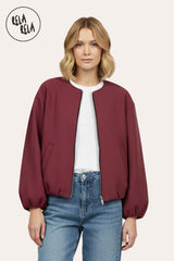 Front view of oversized burgundy zip-up bomber jacket for women