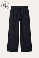 Professional flat lay of the Black wide-leg linen trousers, emphasizing the deep black pigment and the high-end hardware of the drawstring.