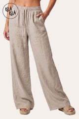Front profile of the Cream wide-leg trousers, showcasing the flattering 30-inch leg length and the fluid, non-restrictive movement of the linen fabric.