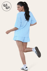 Back view of baby blue crochet co ord set featuring loose top and shorts