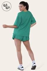 Back view of emerald green crochet co ord set featuring loose top and shorts