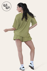 Back view of olive green crochet co ord set featuring loose top and fitted shorts