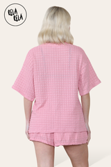 Back view of pink knitted co-ord set with T-shirt and shorts