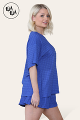 Side view of royal blue two piece outfit – oversized top and co-ordinating shorts