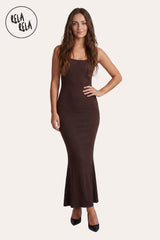 Front model view of RELA RELA Soft Touch Stretch Rib Maxi Cami Dress in Chocolate, showing the slim straps, ribbed fabric and longline silhouette.