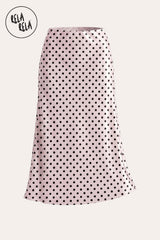 Professional flat lay of the Pink satin polka dot maxi skirt, highlighting the premium fabric texture and the classic monochromatic print detail.