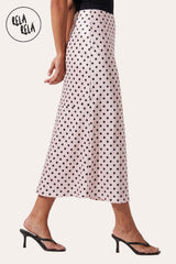 Side profile of the Pink flowy satin skirt, showcasing the fluid movement, bias-cut drape, and the long-line maxi length.