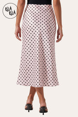 Rear view of the Pink polka dot maxi skirt, demonstrating the smooth, gap-free waistband and the flattering, effortless silhouette.