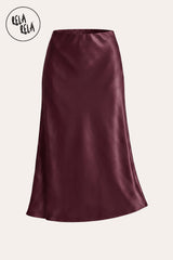 A professional flat lay of the Black slim straight satin maxi skirt, highlighting the luxurious fabric texture, classic monochrome aesthetic, and high-quality tailoring.