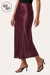 Side profile of the Plum slim straight satin skirt, showcasing the flattering, body-skimming silhouette and the sophisticated floor-length maxi drape.