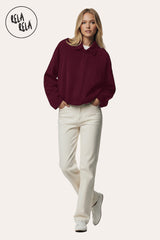 Front view of Model wearing in burgundy faux suede bomber jacket for women, smooth soft texture with zip-up front.