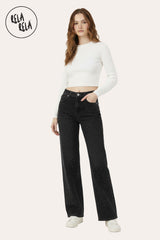 Lifestyle shot of woman wearing black all-over rhinestone dad fit jeans