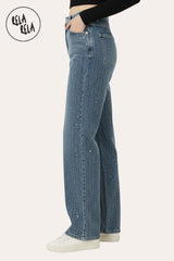 Close-up of all-over sparkling rhinestones on denim blue dad fit stretchy jeans