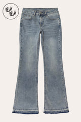  flat lay of the viral stretchy bootcut flared jeans in Vintage Blue on a petite model, showcasing the authentic washed indigo and Y2K low-rise fit.