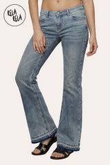Front view of the viral stretchy bootcut flared jeans in Vintage Blue on a petite model, showcasing the authentic washed indigo and Y2K low-rise fit.
