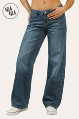 Front view of the viral stretchy wide leg jeans in Denim Blue on a petite model, featuring a deep indigo wash and Y2K low-rise fit.