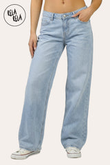 Front view of the viral stretchy wide leg jeans in light blue on a petite model, showing the high-stretch denim and Y2K low-waist fit.