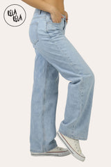 Side view of the viral stretchy fabric on light blue wide leg jeans, highlighting the flexible and comfortable premium denim.