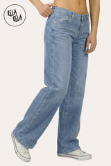 Side profile of the petite-friendly viral stretchy jeans in Mid Blue, demonstrating the leg-lengthening wide-leg silhouette and hip-hugging low-rise cut.