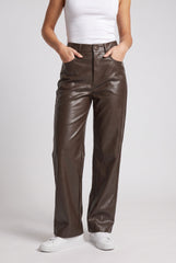 Front model view of RELA RELA Chocolate high waist faux leather straight leg trousers, showing the wide-leg fit and glossy PU leather finish.