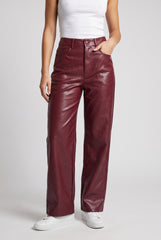 Front model view of RELA RELA Burgundy high waist faux leather straight leg trousers, showing the wide-leg fit and glossy PU leather finish.