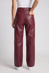 Back model view of RELA RELA Burgundy high waist faux leather trousers, showing the rear pockets and straight wide-leg silhouette.