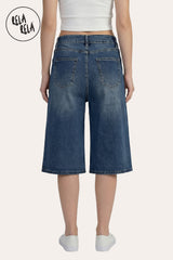 Rear view of the baggy denim blue shorts, demonstrating the authentic five-pocket construction and the heavy-duty denim quality.