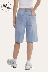 Back view showing the relaxed baggy fit and longline silhouette of the blue denim shorts.
