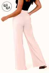 Back view of beige plissé wide leg trousers – adjustable drawstring waist on trousers with pleats.