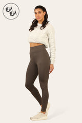 Side angle showing womens fleece lined leggings in chocolate