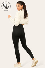 Back view of ladies thermal leggings in black fleece lining