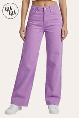 Front view of a model wearing the Rela Rela Lilac stretchy wide leg dad fit jeans. Featuring a high-rise fit and a relaxed retro silhouette in a soft pastel tone.