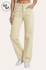 Front view of a model wearing the Rela Rela Lemon stretchy wide leg dad fit jeans. Featuring a high-rise fit and a relaxed retro silhouette in a bright pastel tone.