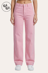 Front view of a model wearing the Rela Rela Pink stretchy wide leg dad jeans. Featuring a high-rise fit and a relaxed retro silhouette in a summer pastel wash.