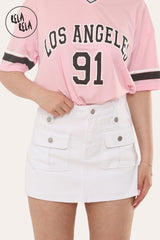 White stretchy mid-rise cargo denim skorts with front utility pockets